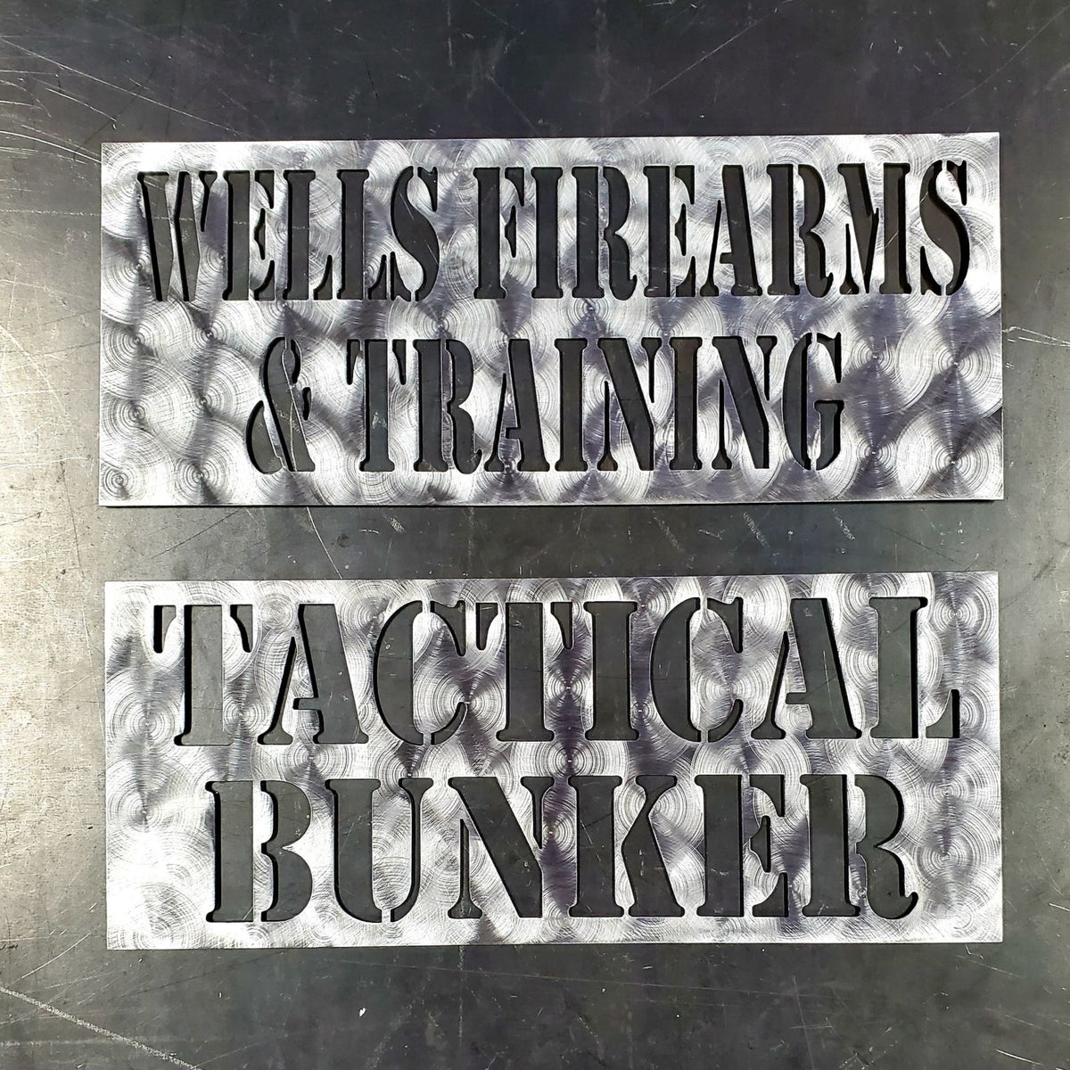 Wells Firearms and Tactical Bunker text plates by Elite Metalworking