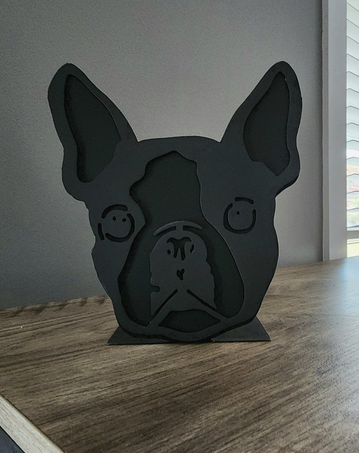 Freestanding metal dog portrait displayed on a tabletop base by Elite Metalworking