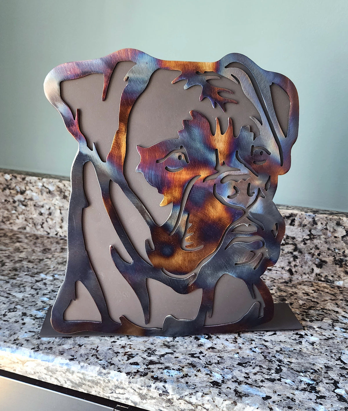 Freestanding metal dog portrait displayed on a tabletop base by Elite Metalworking