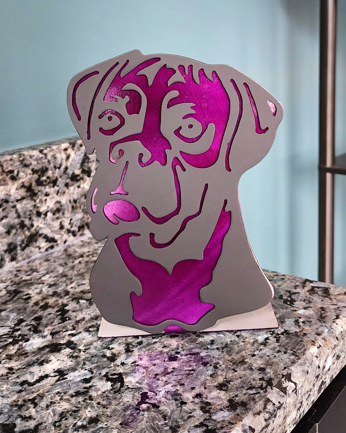 Freestanding metal dog portrait displayed on a tabletop base by Elite Metalworking