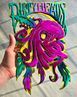 Customer holding colorful octopus band artwork by Elite Metalworking