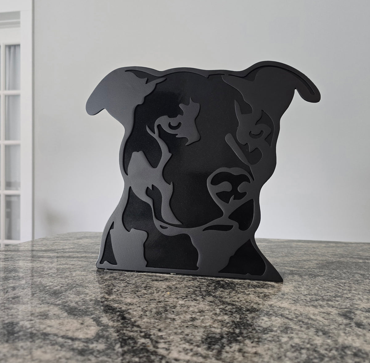 Freestanding metal dog portrait displayed on a tabletop base by Elite Metalworking