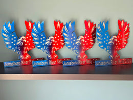 Red and blue winged metal awards in a row by Elite Metalworking
