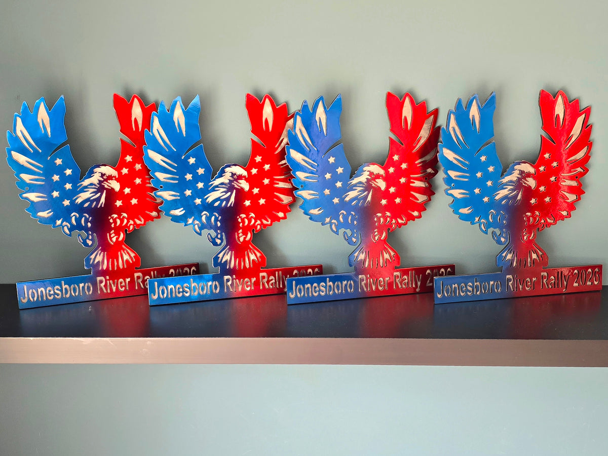 Red and blue winged metal awards in a row by Elite Metalworking