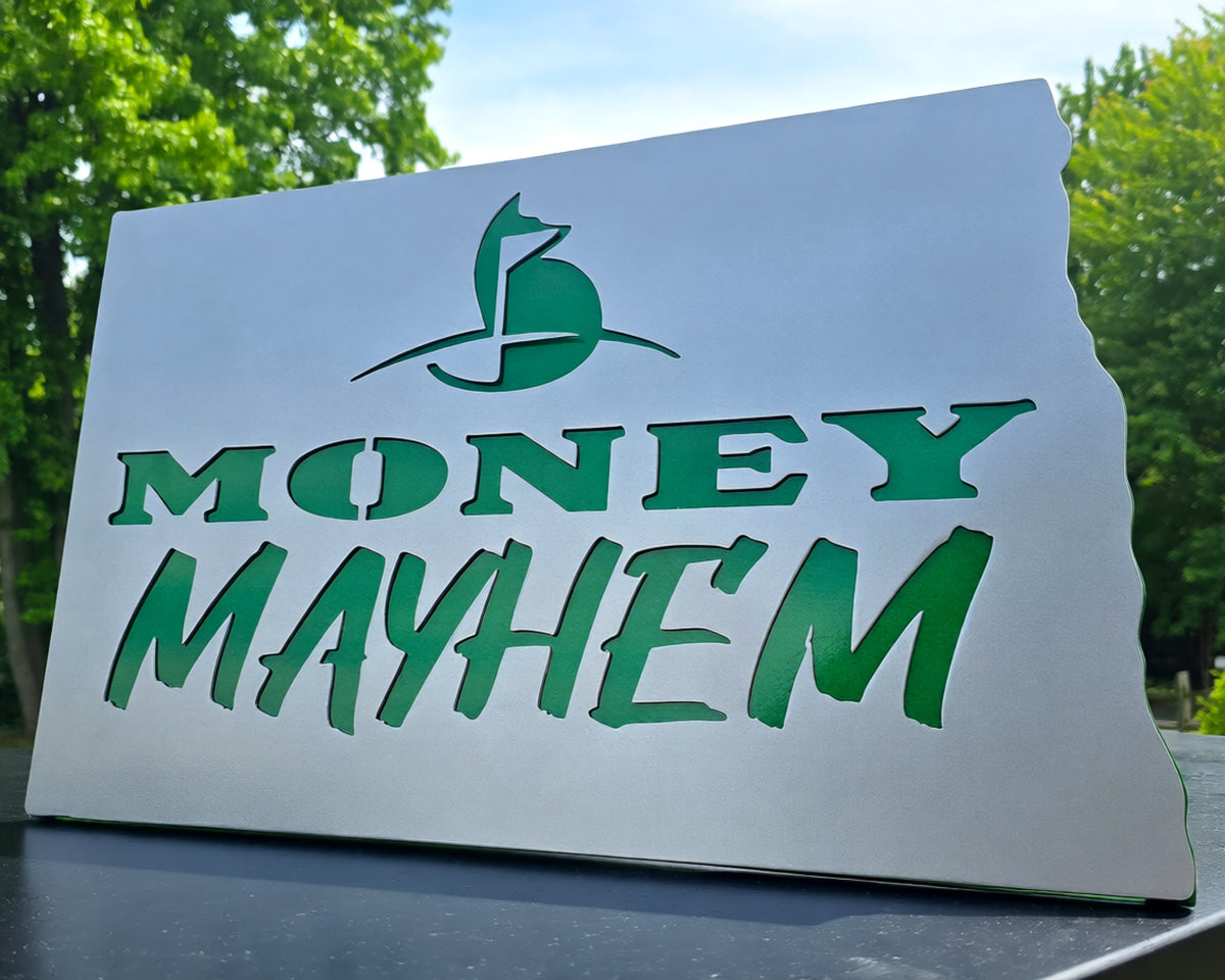 Green Money Mayhem logo cut into a rectangular metal panel by Elite Metalworking