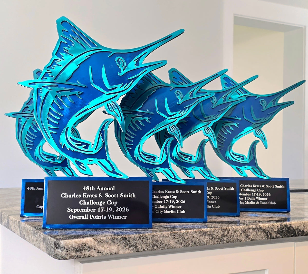 Blue marlin tournament trophies with engraved plates in three sizes by Elite Metalworking