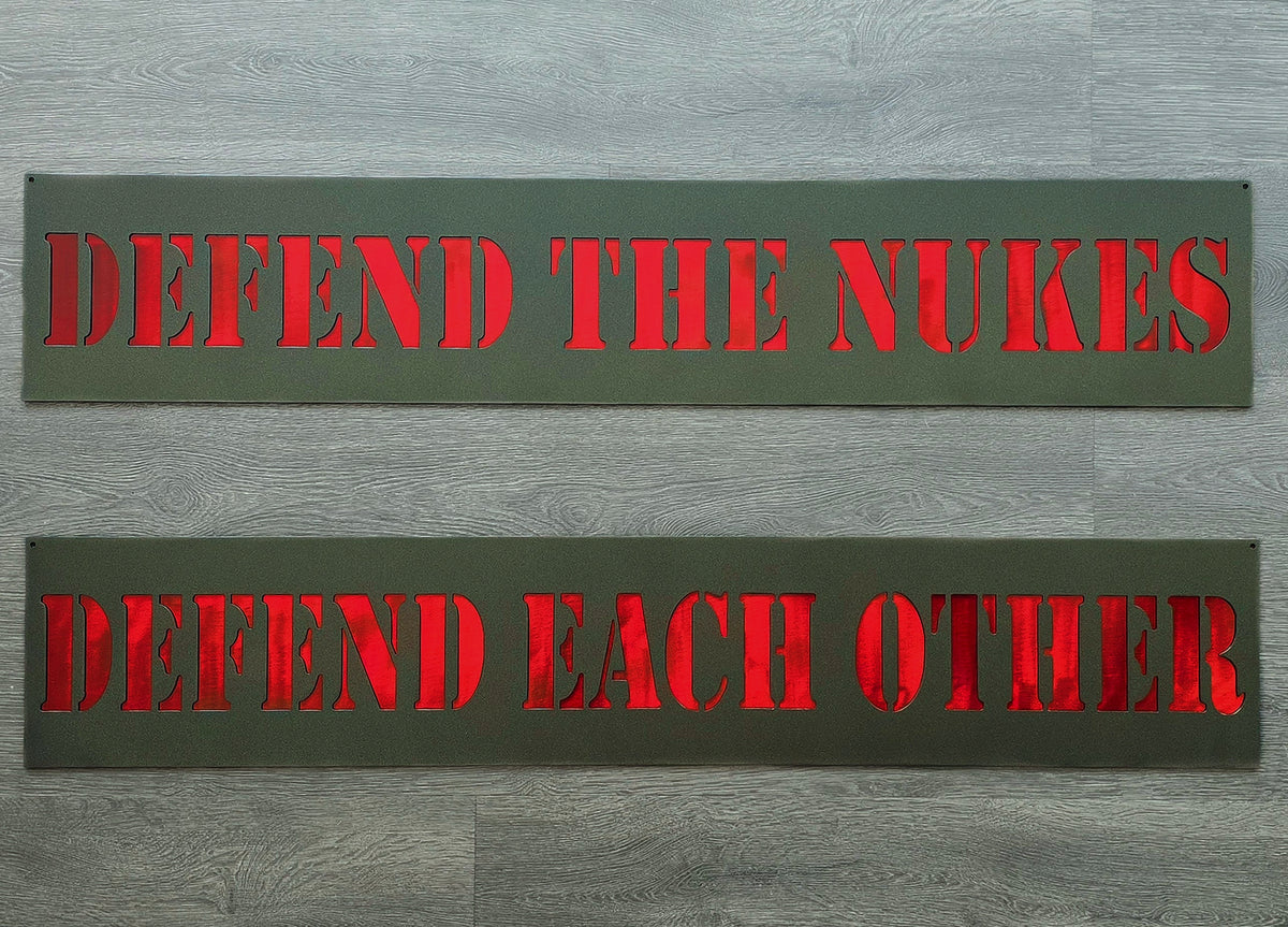 Defend the Nukes and Defend Each Other text plates by Elite Metalworking