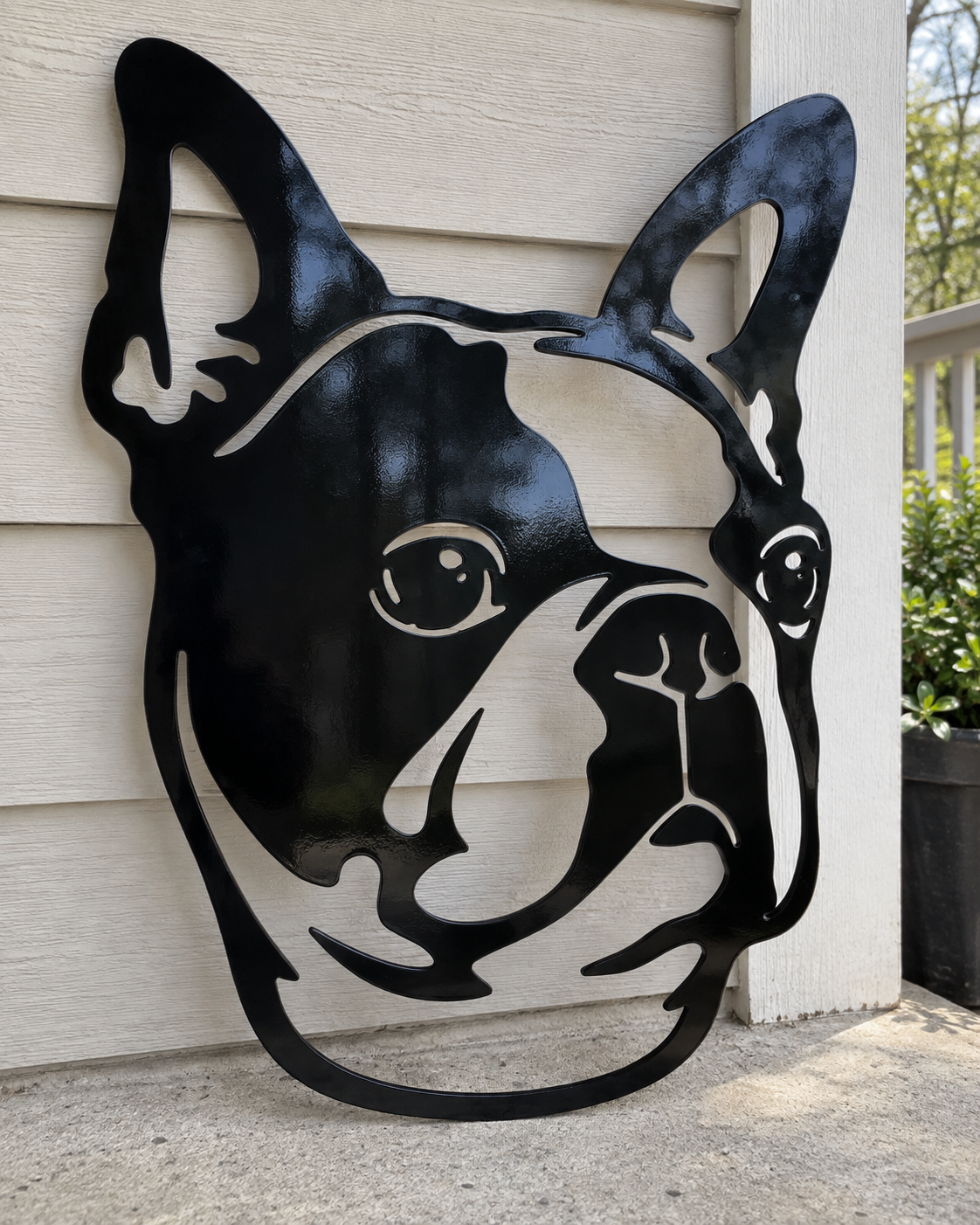 Boston Terrier two-layer steel metal wall art, gloss black front design, leaning against a porch