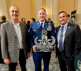Military award presentation with a custom metal emblem by Elite Metalworking