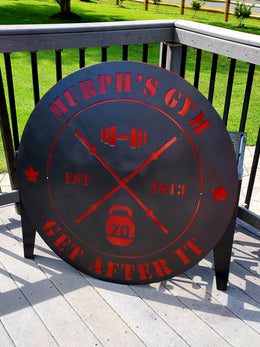 Round black and red custom metal sign for Murphy's Gym