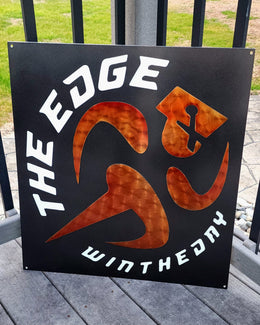 Custom black and orange metal fitness sign for The Edge