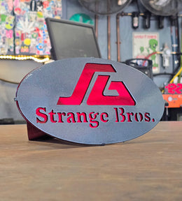Strange Bros oval business hitch cover by Elite Metalworking