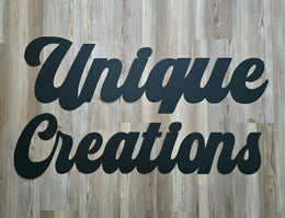 Unique Creations script lettering by Elite Metalworking