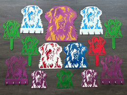 Colorful dog portrait signs and garden stakes displayed as a group by Elite Metalworking
