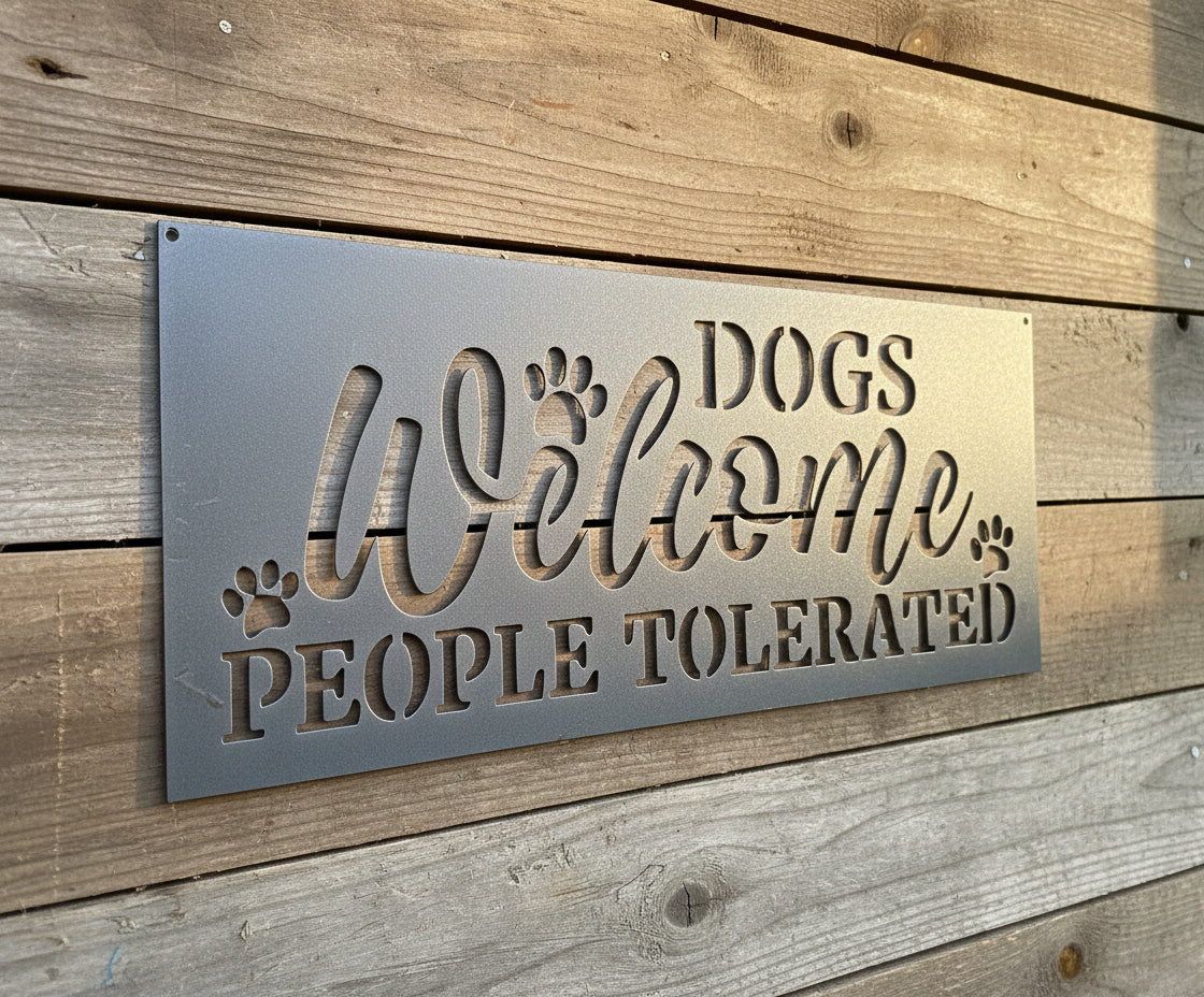 Metal sign with 'DOGS Welcome PEOPLE TOLERATED' text on a metallic background