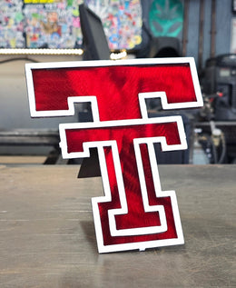 Two-layer sports team metal hitch cover by Elite Metalworking