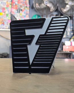 Black and silver geometric hitch cover by Elite Metalworking