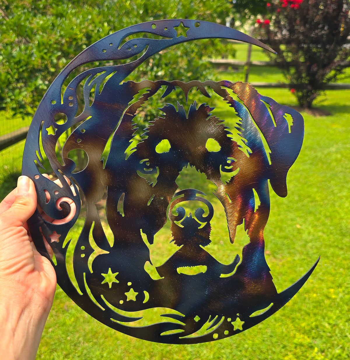 Dark Rottweiler on the Moon metal art held outdoors by Elite Metalworking