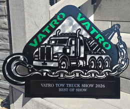Tow-truck show award with green lettering and an engraved plate by Elite Metalworking