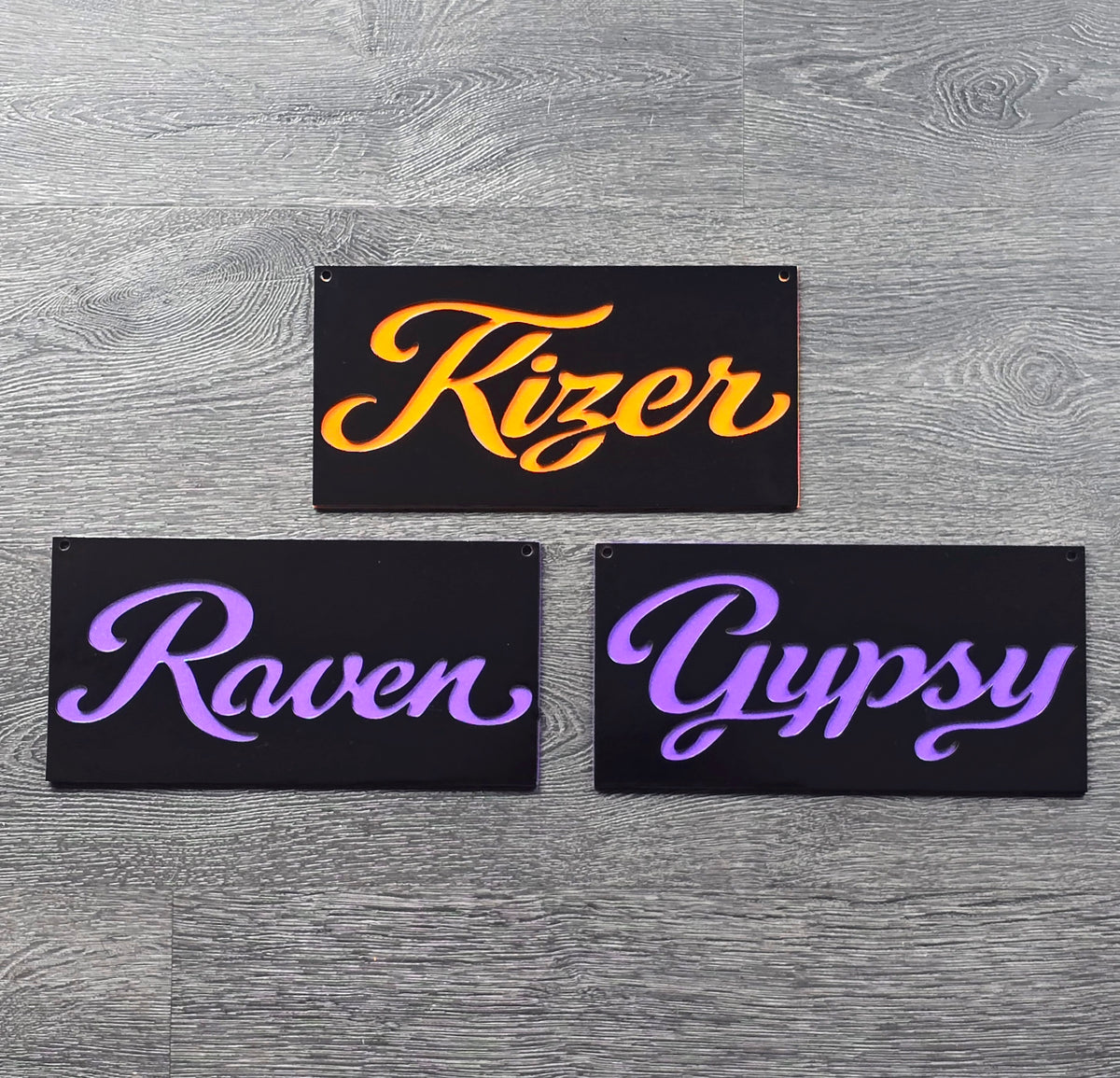 Black nameplates with colorful Kizer, Raven and Gypsy script lettering by Elite Metalworking