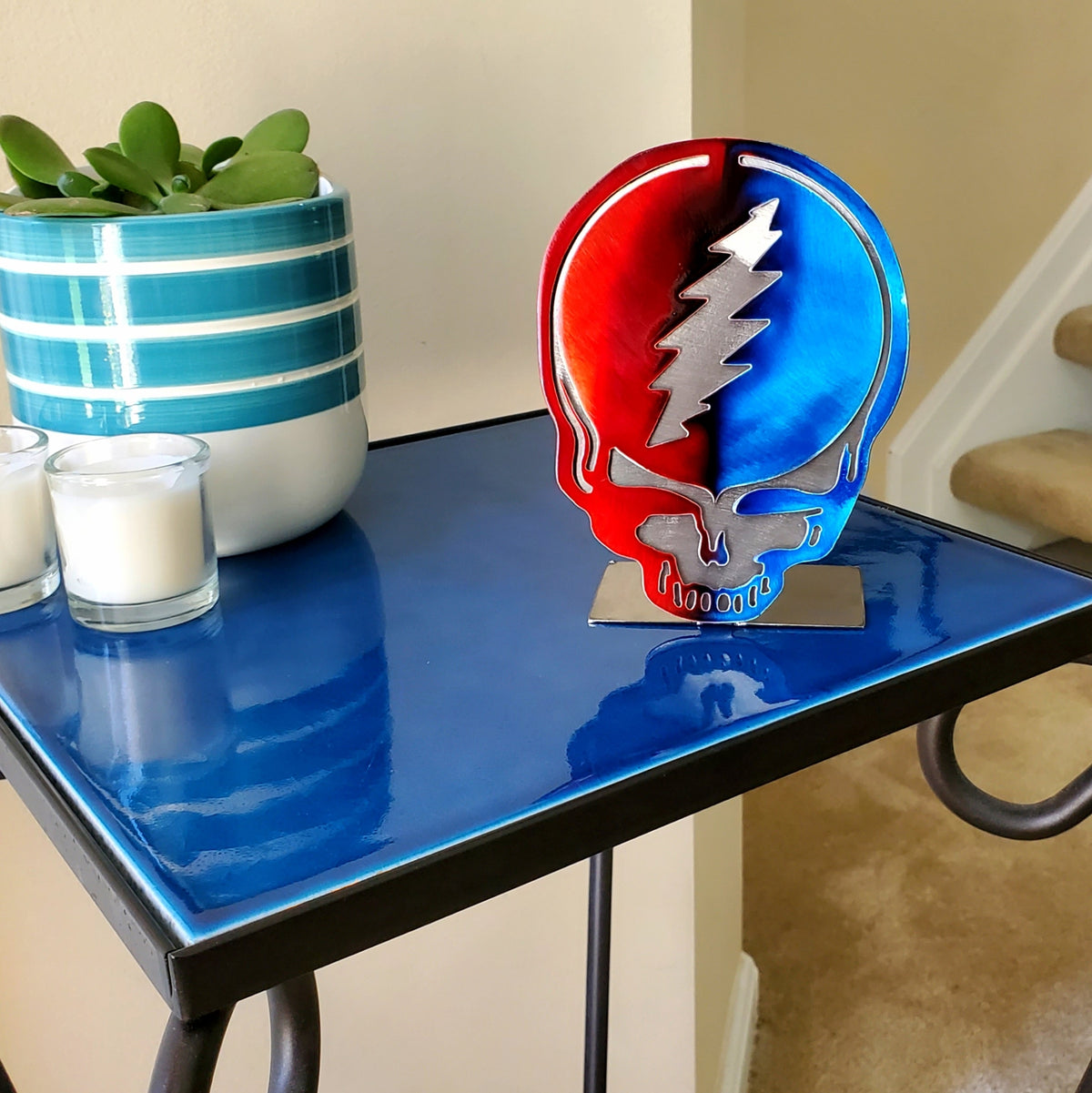 Red and blue lightning bolt skull tabletop artwork by Elite Metalworking