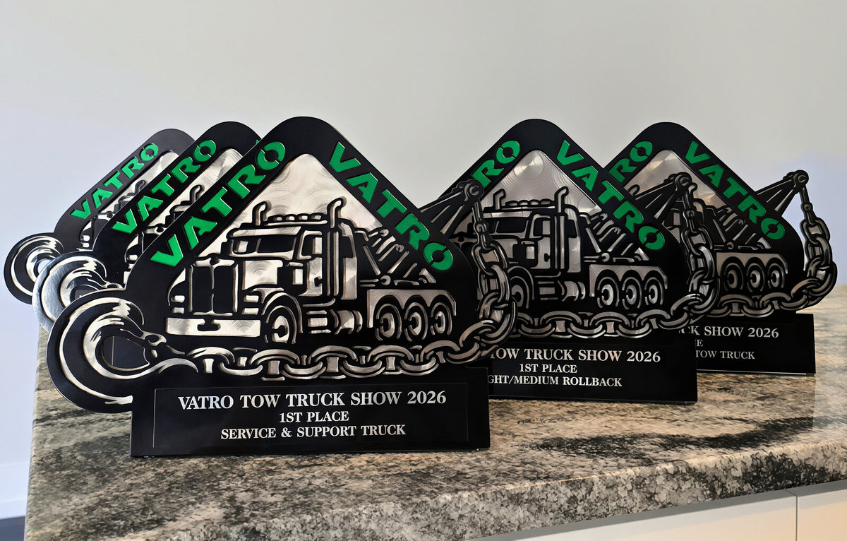 Group of custom tow-truck show awards by Elite Metalworking