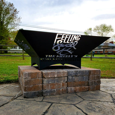 Custom steel fire pit with a company logo and truck artwork by Elite Metalworking