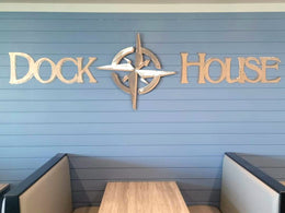 Dock House restaurant lettering installed on siding by Elite Metalworking