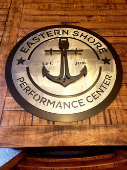 Eastern Shore Performance Center sign on a wood wall by Elite Metalworking