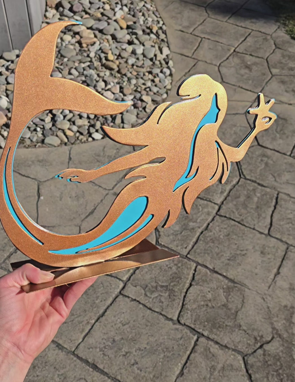 Video showing orange mermaid metal art by Elite Metalworking