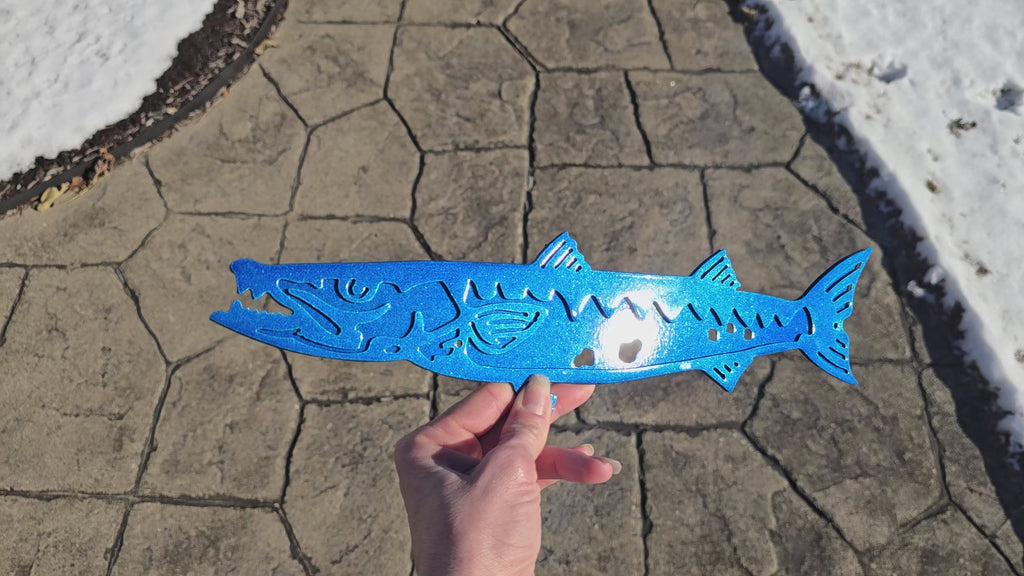 Blue fish-shaped metal artwork with cutout lettering by Elite Metalworking