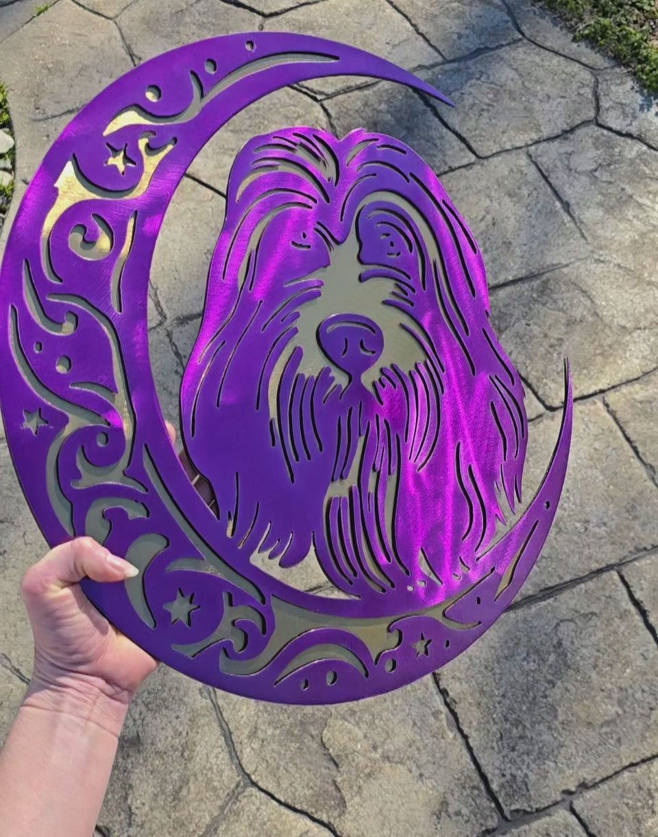 Video showing purple and gold dog-on-the-moon art by Elite Metalworking