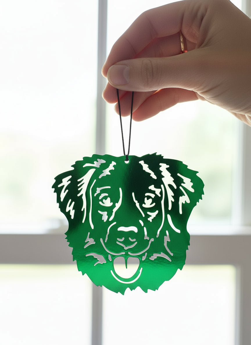 A custom metal art ornament in the shape of a Duck Tolling Retriever with a powder-coated finish, displayed against a textured background.