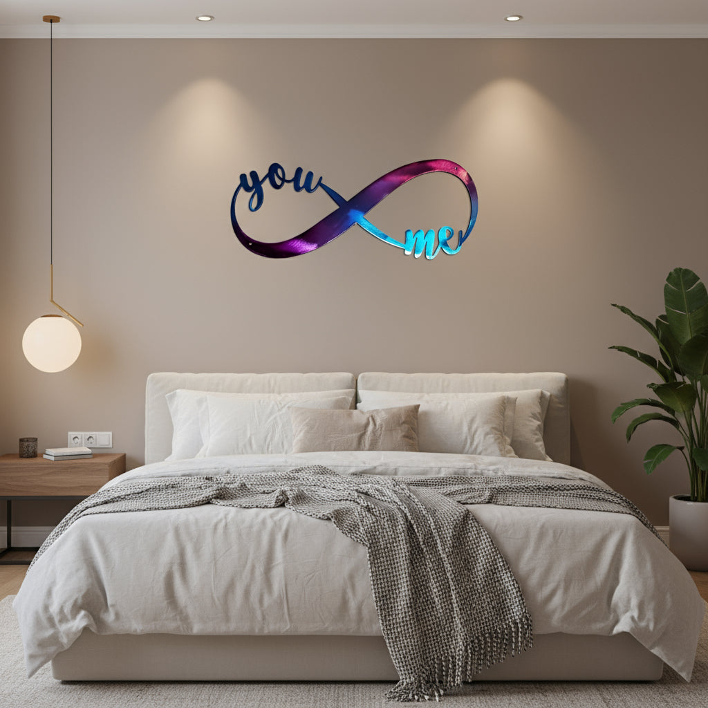 A metal art piece with an infinity symbol and the text 'You & Me' in a cursive script, primarily in blue and purple colors.